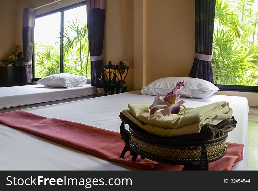 White bed and red towel in spa. White bed and red towel in spa