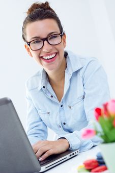 Woman With Laptop Working At Home Royalty Free Stock Images
