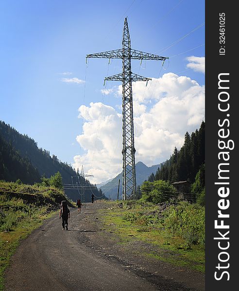 Group of tourists hiking in mountains