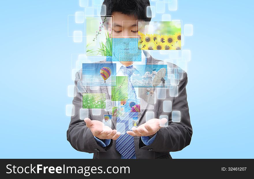 Businessman hand holding streaming images virtual buttons