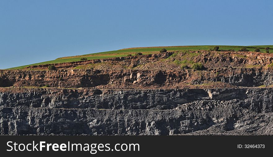 Landscape with rock quarry in a hill