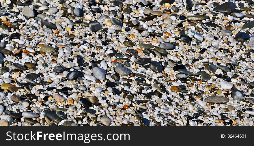 Close up of beach pebbles after rain