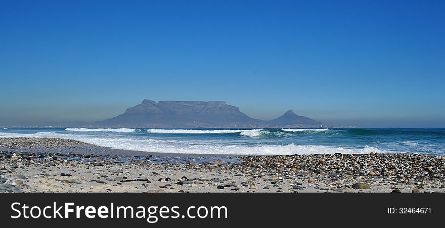 Landscape with sand dunes and Table Mountain