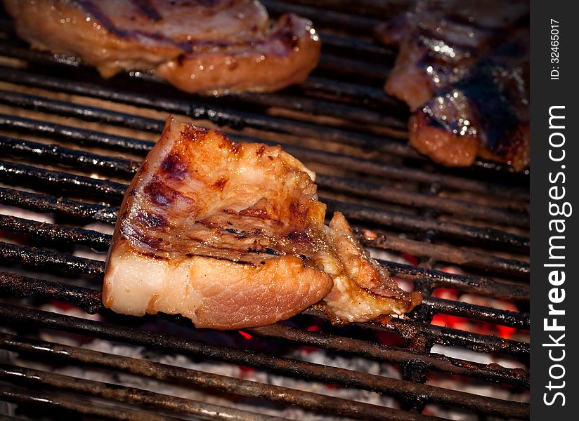 Barbecue grill pork on fire