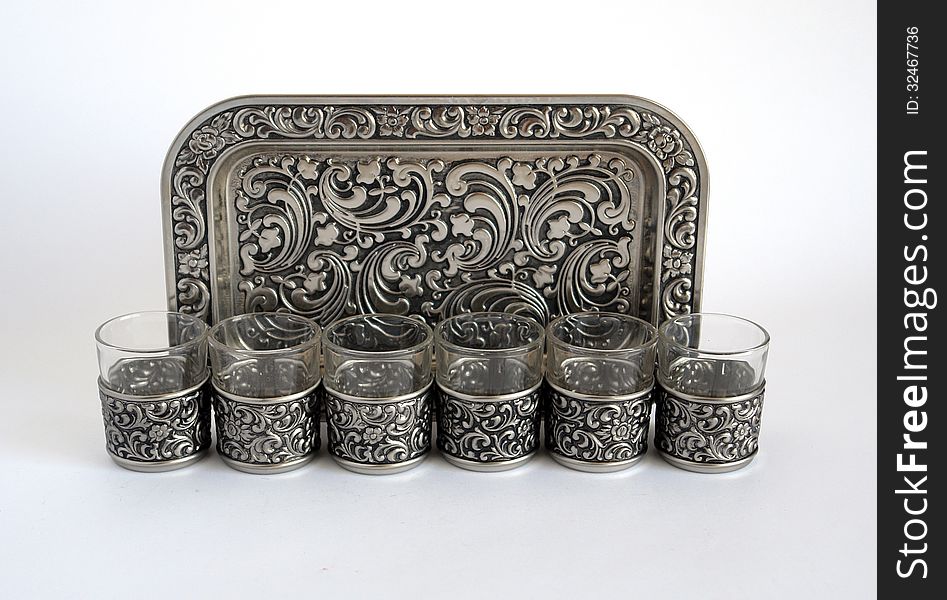 Old silver wine glasses with a tray