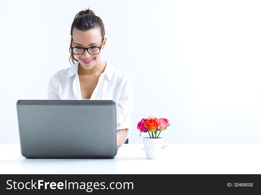 Woman with laptop working at home