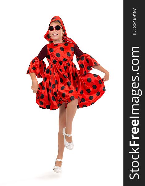 Teen girl dancing in a red polka-dot dress with sunglasses