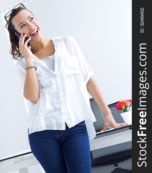 Young woman talking on the mobile phone