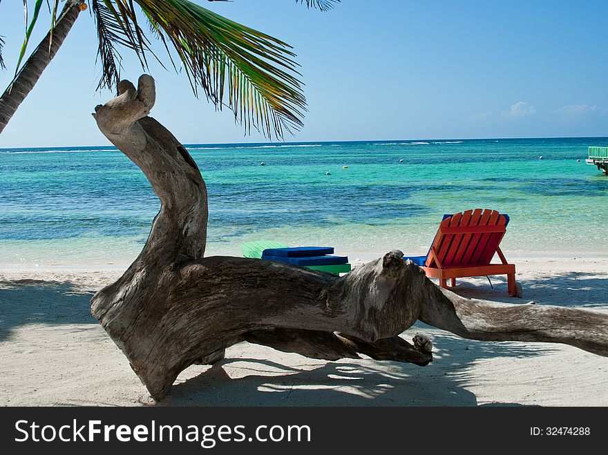 Colorful accents on a white sandy beach. Colorful accents on a white sandy beach.