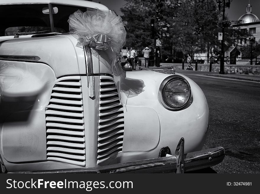 Vintage old Chevrolet awaits the return of the newly weds from the photo soot in Old Montreal. Vintage old Chevrolet awaits the return of the newly weds from the photo soot in Old Montreal