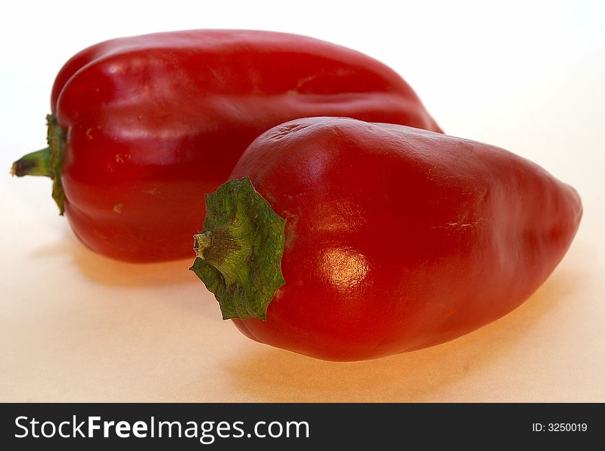Red peppers on white background.