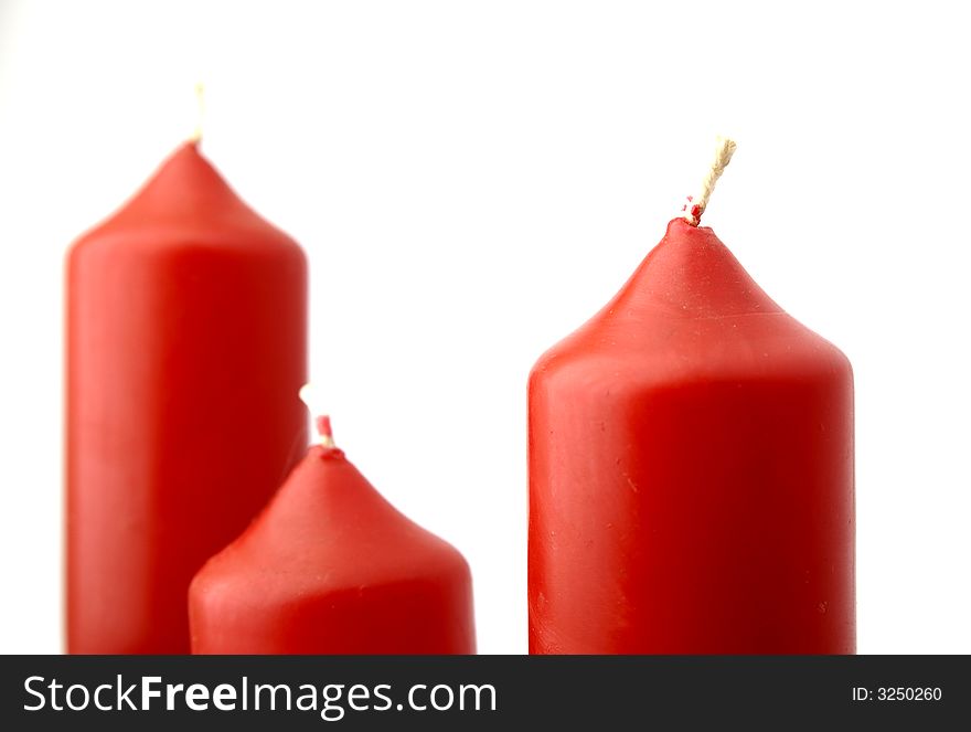 Relaxing image consisting of a macro of three red candles