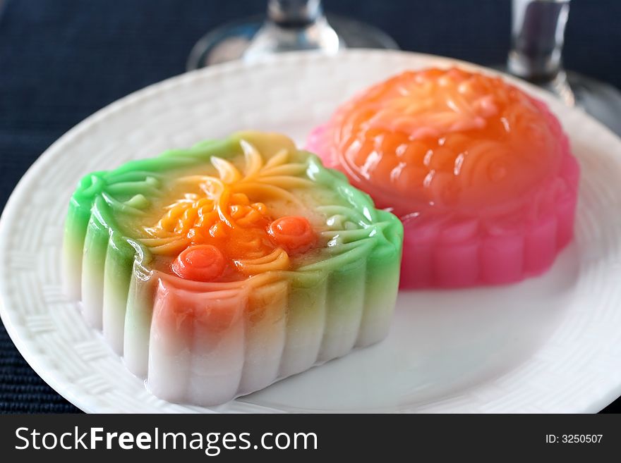 Colorful fruit and egg flavored mooncakes with goldfish patterns signifying prosperity and wealth. Colorful fruit and egg flavored mooncakes with goldfish patterns signifying prosperity and wealth