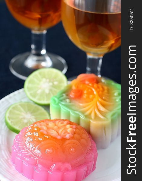 Colorful fruit and egg flavored mooncakes with goldfish patterns signifying prosperity and wealth. Colorful fruit and egg flavored mooncakes with goldfish patterns signifying prosperity and wealth