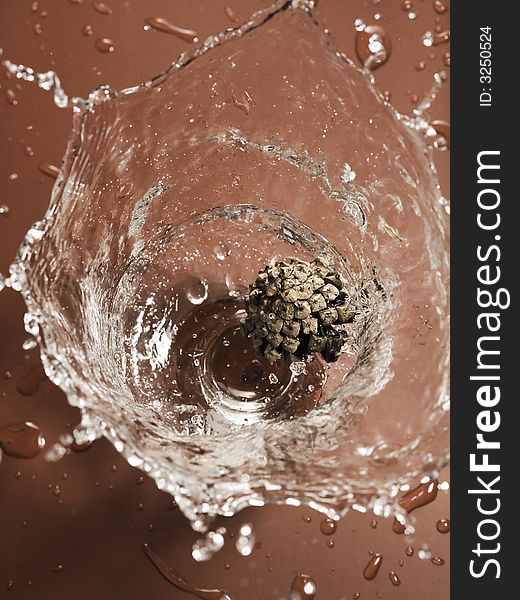 Strong splash in a glass with water