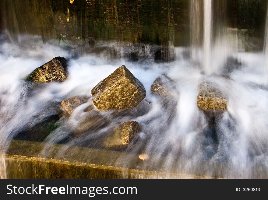 Small waterfall and brilliant stones