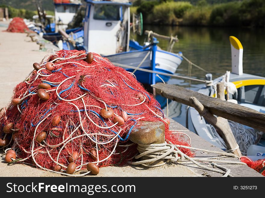 Commerce and industry: red fishing nets and boats