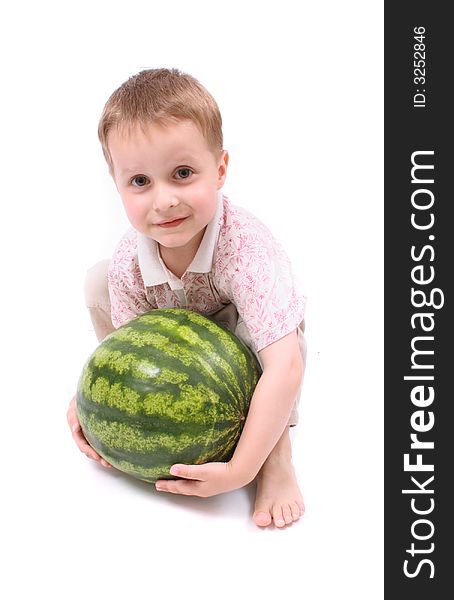 Young boy and watermelon on the white background. Young boy and watermelon on the white background