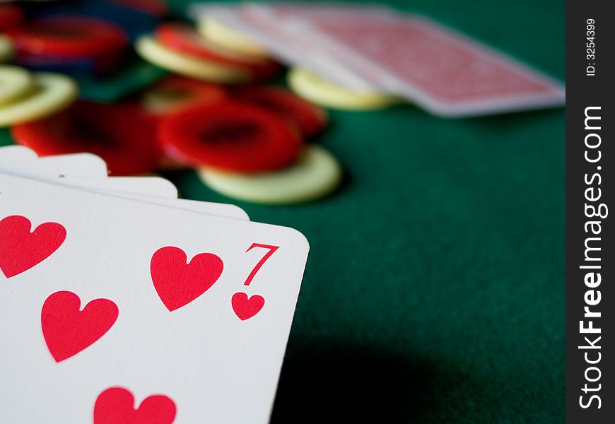 Cards and chips on green table