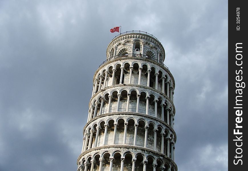 Leaning Tower of Pisa , Italy , Tuscany on a background of the sky with clouds. Miracle of Renaissance european architecture.