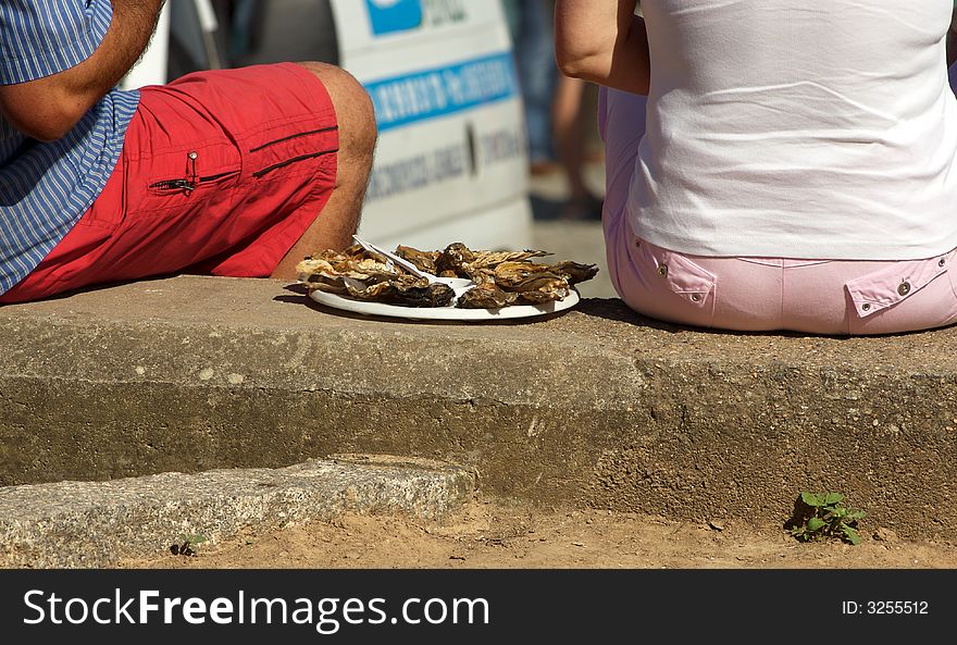 Eating Oysters At Street