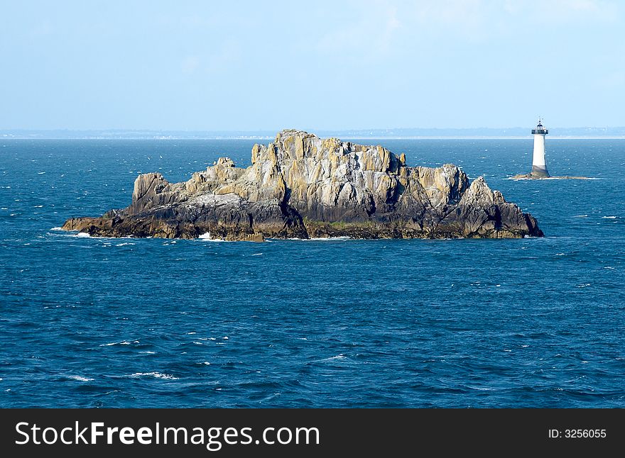 Rocks And Lighthouse