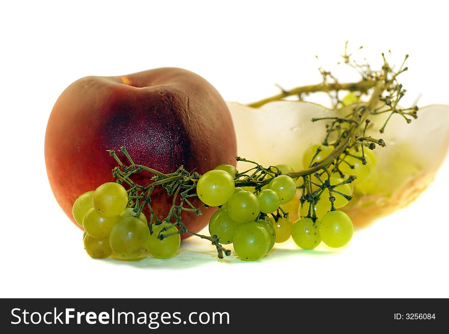 Bowl filled with bunch of grapes and peach. Bowl filled with bunch of grapes and peach