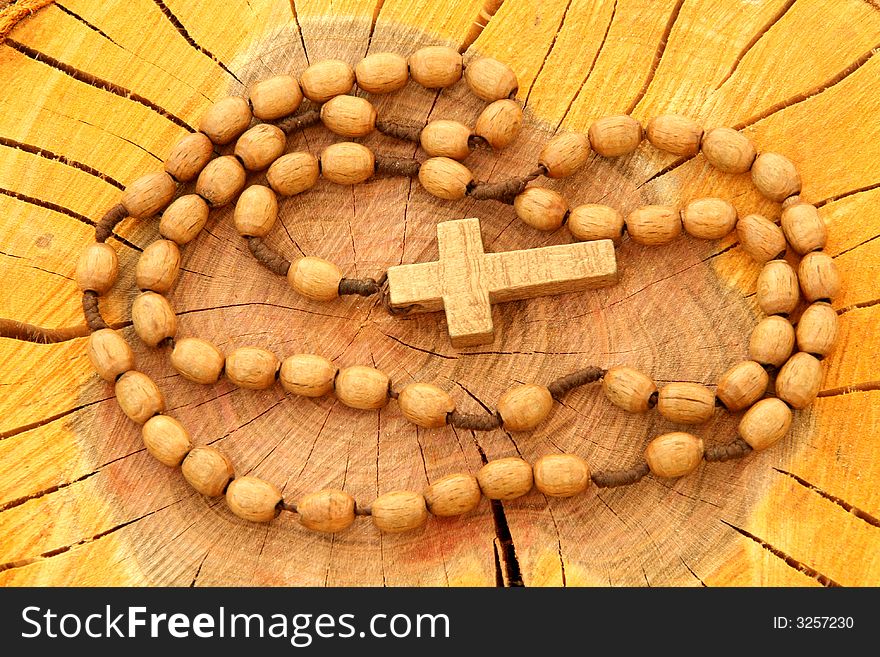 Wooden Rosary On Wood