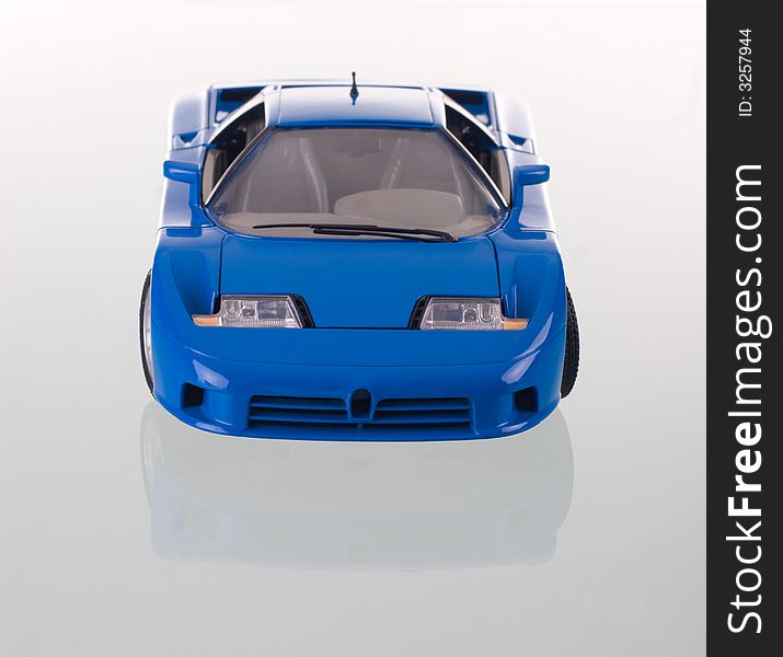 Blue car with reflection. Studio shot. Blue car with reflection. Studio shot