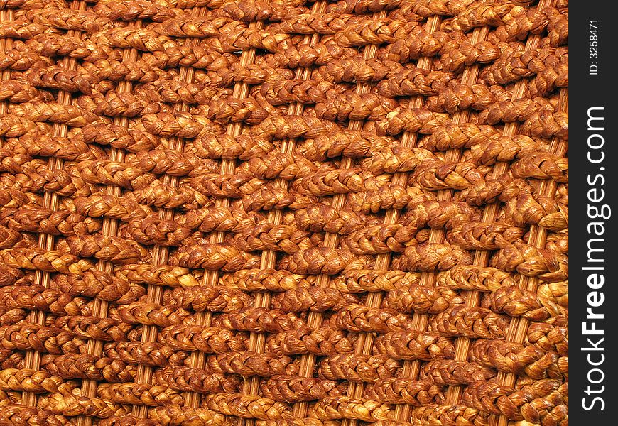 A medium close up of rattan plaited mats. A medium close up of rattan plaited mats