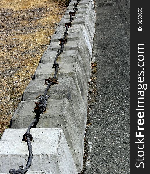 Shot of row of concrete barriers that are attached. Shot of row of concrete barriers that are attached.