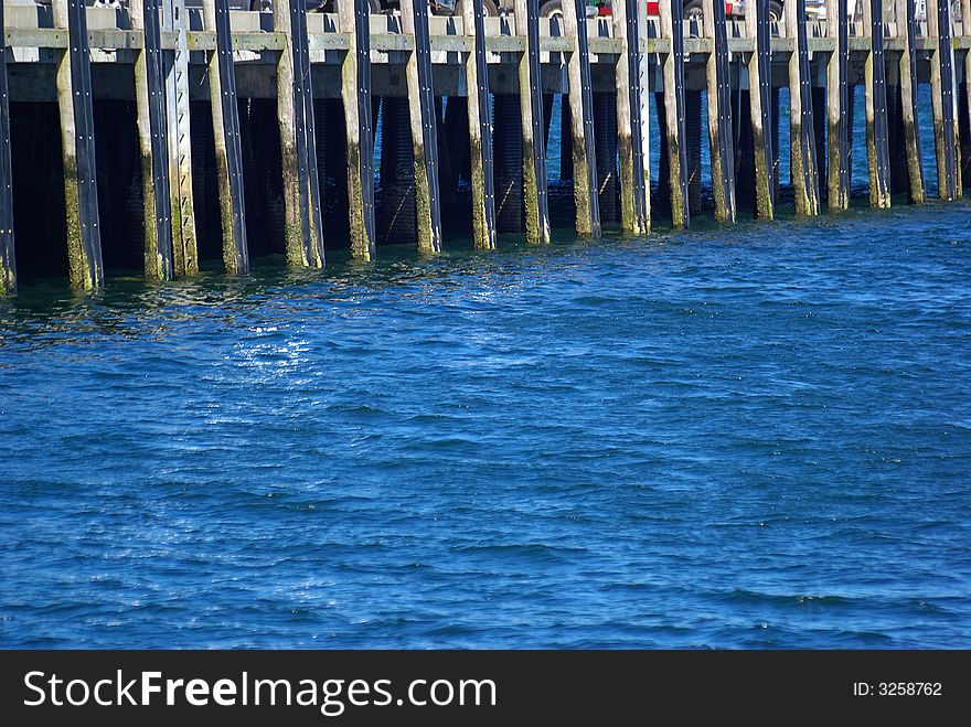 Supports of a pier in the water at Cape Cod. Supports of a pier in the water at Cape Cod.