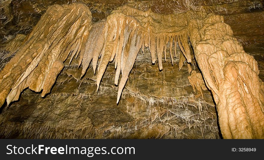 Large sandstone stalactites hang from the ceiling in Smoke Hole Caverns, WV.