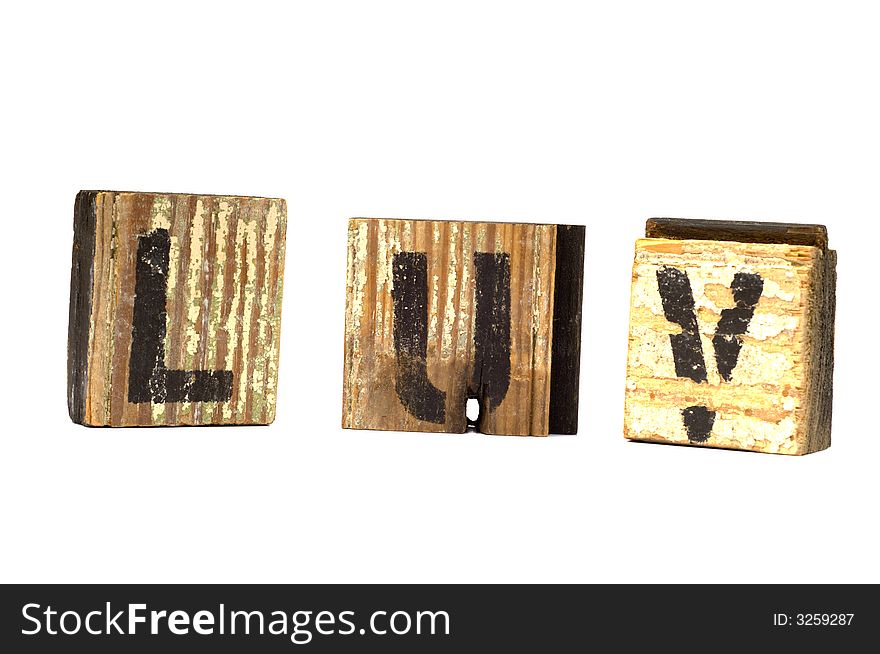 Love decoration with love spelled phonetically on wooden blocks on a white background - possible valentine's day decoration