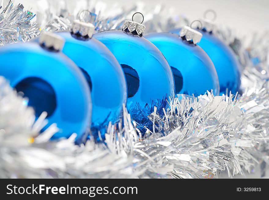 A shot of blue and silver christmas ornaments