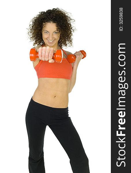 Young, beautiful woman working out with dumbbells. Smiling and looking at camera. Isolated od white in studio. Front view. Young, beautiful woman working out with dumbbells. Smiling and looking at camera. Isolated od white in studio. Front view