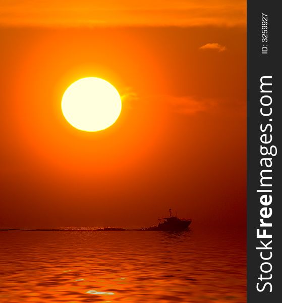 Sunset and boat in the sea