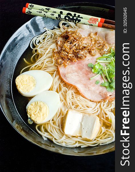 Chinese noodel clear soup with ham and egg. Chinese noodel clear soup with ham and egg