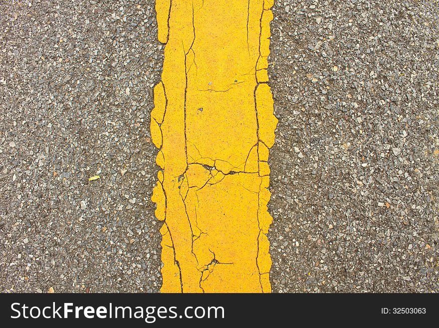 Asphalt dark texture with yellow lines