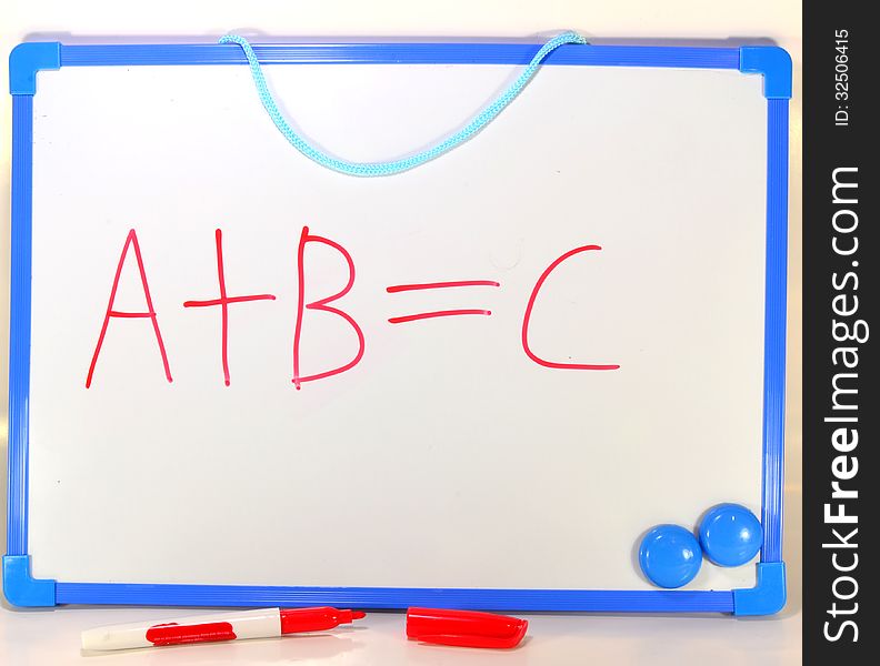 The first three letters of the alphabet A B and C written on a white board in red ink. Symbolic of learning or education. The first three letters of the alphabet A B and C written on a white board in red ink. Symbolic of learning or education.