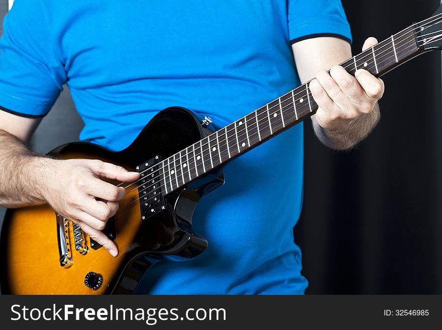 Close up on man playing electric guitar. Close up on man playing electric guitar