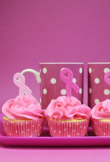 Pink Ribbon Cupcakes With Pink Polka Dot Coffee Mugs - Vertical Stock Photography Pink Ribbon Cupcakes With Pink Polka Dot Coffee Mugs - Vertical Stock Photography
