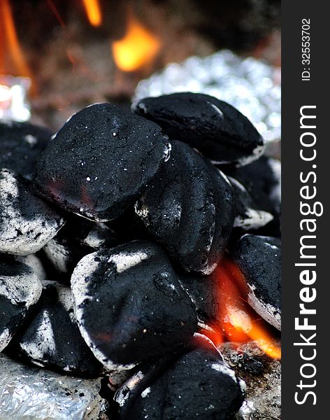 Black charcoal burning macro image