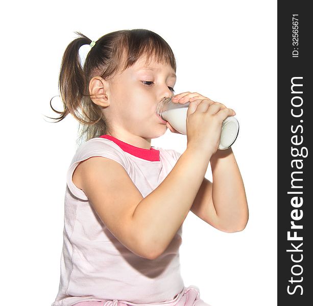 Little Girl Is Drinking Milk From Bottle