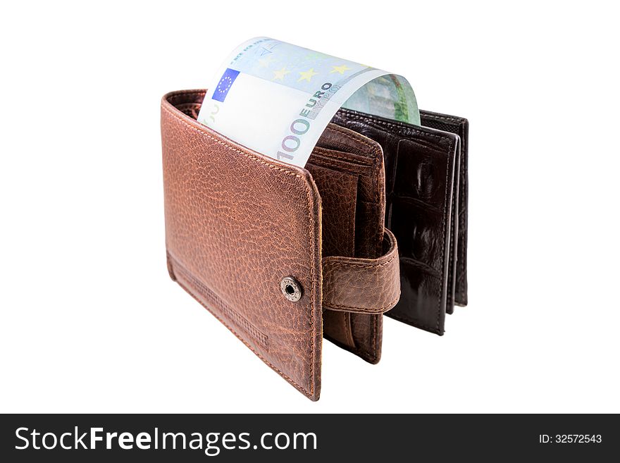 The brown leather wallet with euro is photographed on the close-up