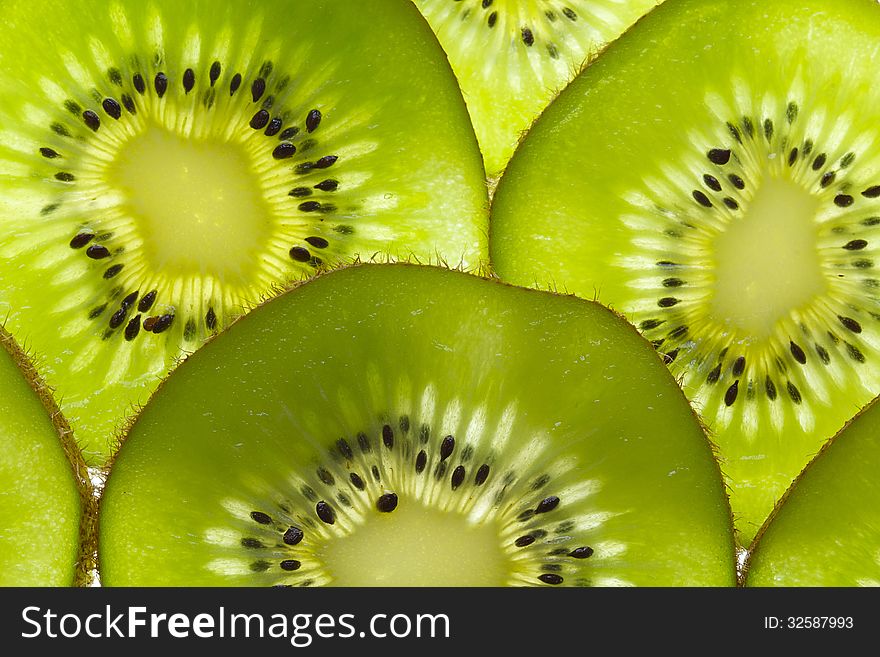 Green kiwi fruit slices close-up