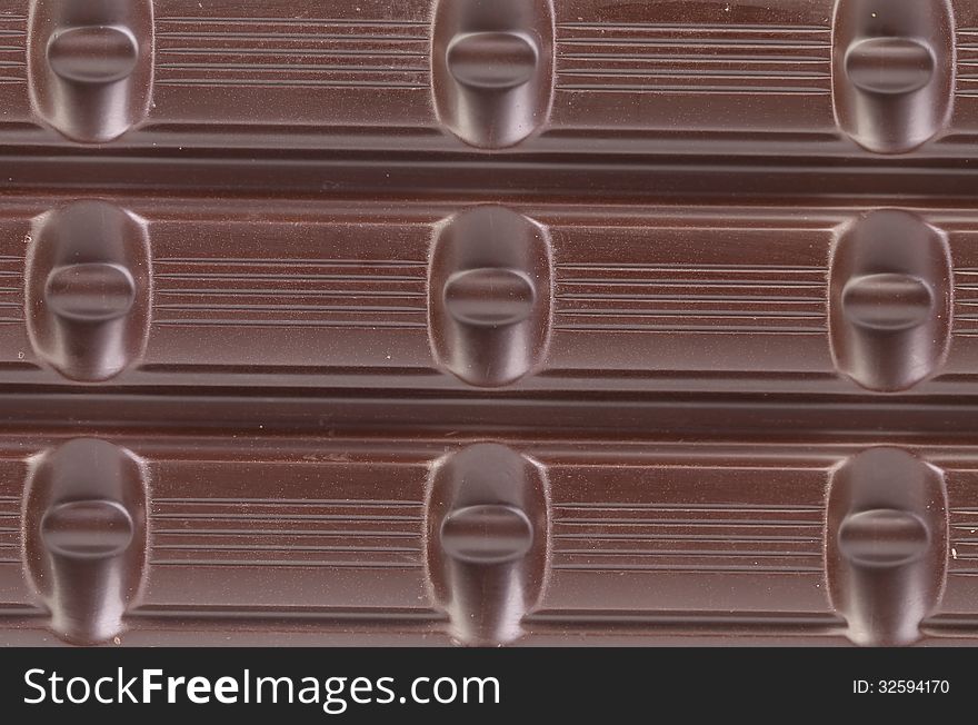 Dark Chocolate Bar As Background.