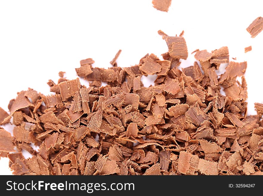 Slices of chocolate. Frame. Top of background is white.