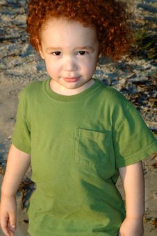 Curly Red-haired Boy At Beach Royalty Free Stock Photos
