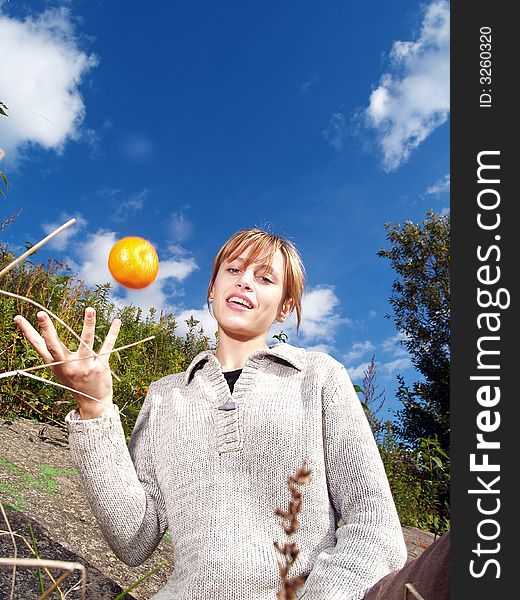 Girl in nature with orange jungling. Girl in nature with orange jungling